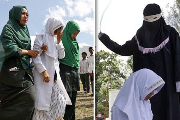 Hukuman berdasarkan hukum syariah - para pelaku perzinahan dicambuk di depan umum di Indonesia